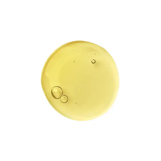 Yellow liquid oil representing vitamin GABA, placed on a white background.