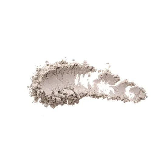 Gray powder representing melatonin, placed on a white background.